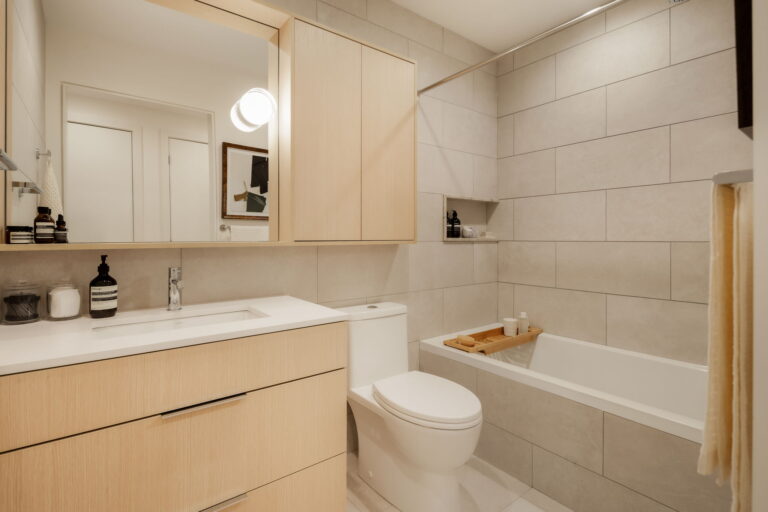 Modern condo bathroom with bathtub and vanity in Ashleigh Oakridge Vancouver