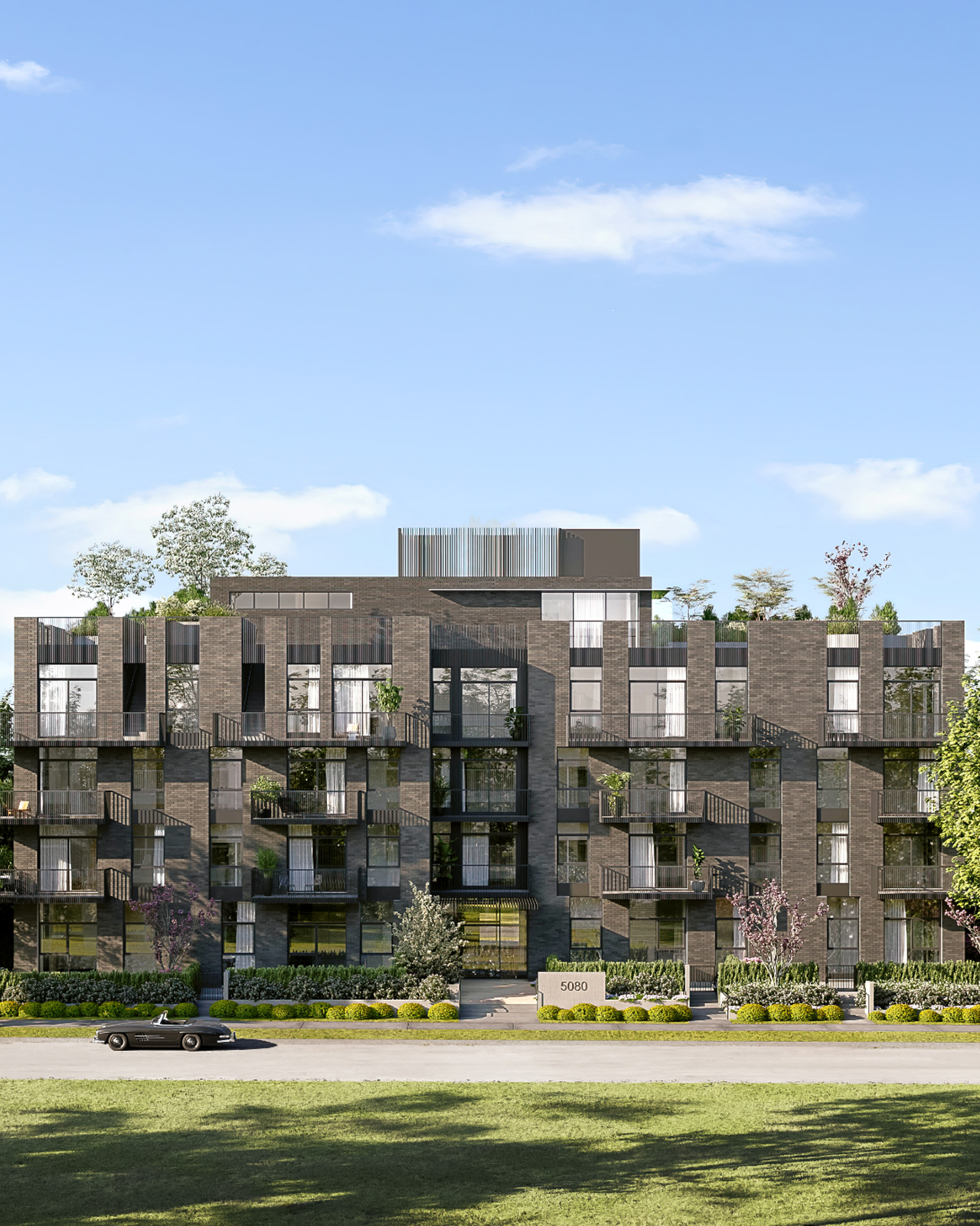 Boutique concrete condo building exterior in Oakridge Vancouver with modern architecture and greenery