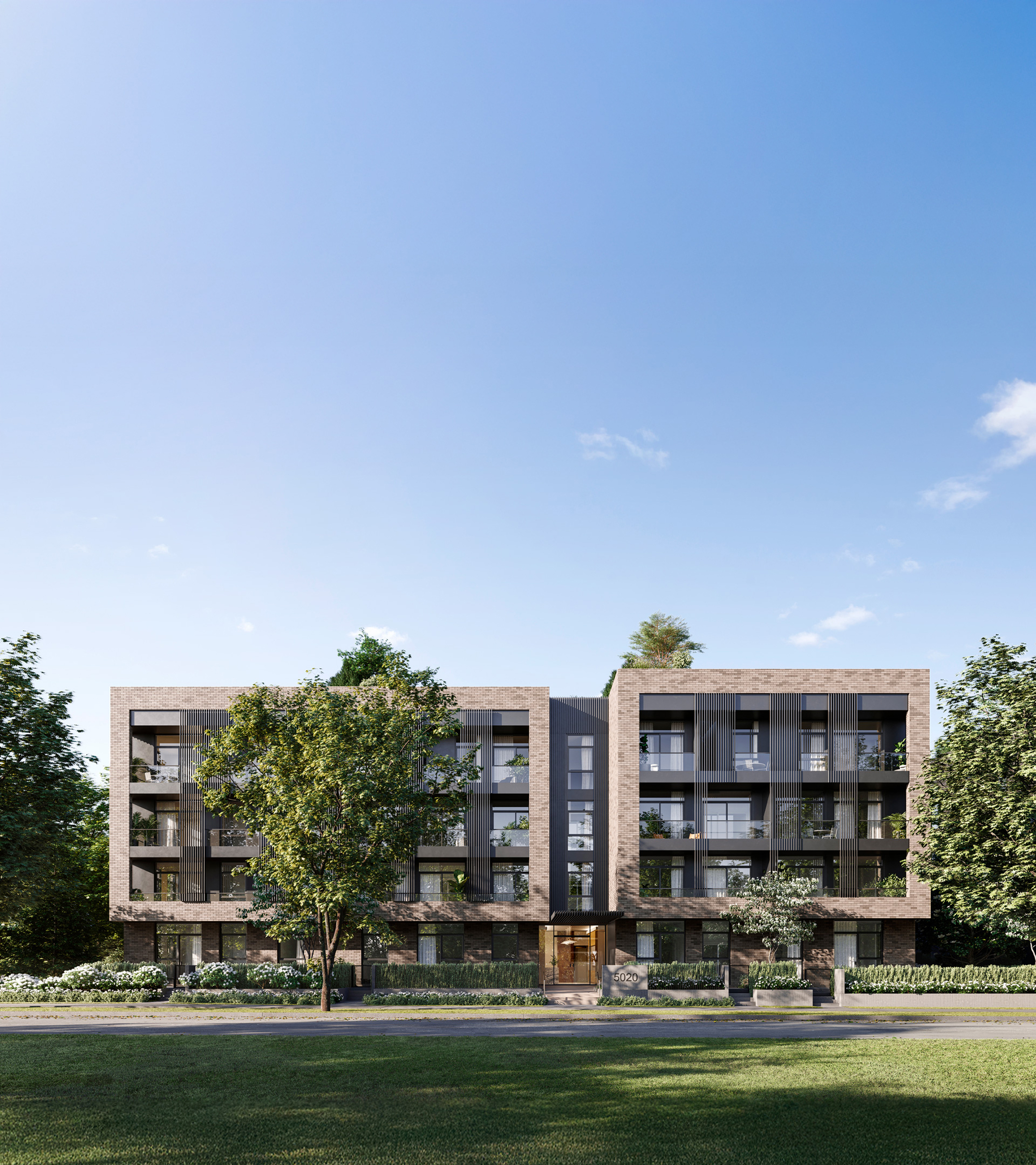 Boutique concrete condo building in Oakridge Vancouver with modern architecture and landscaped green space
